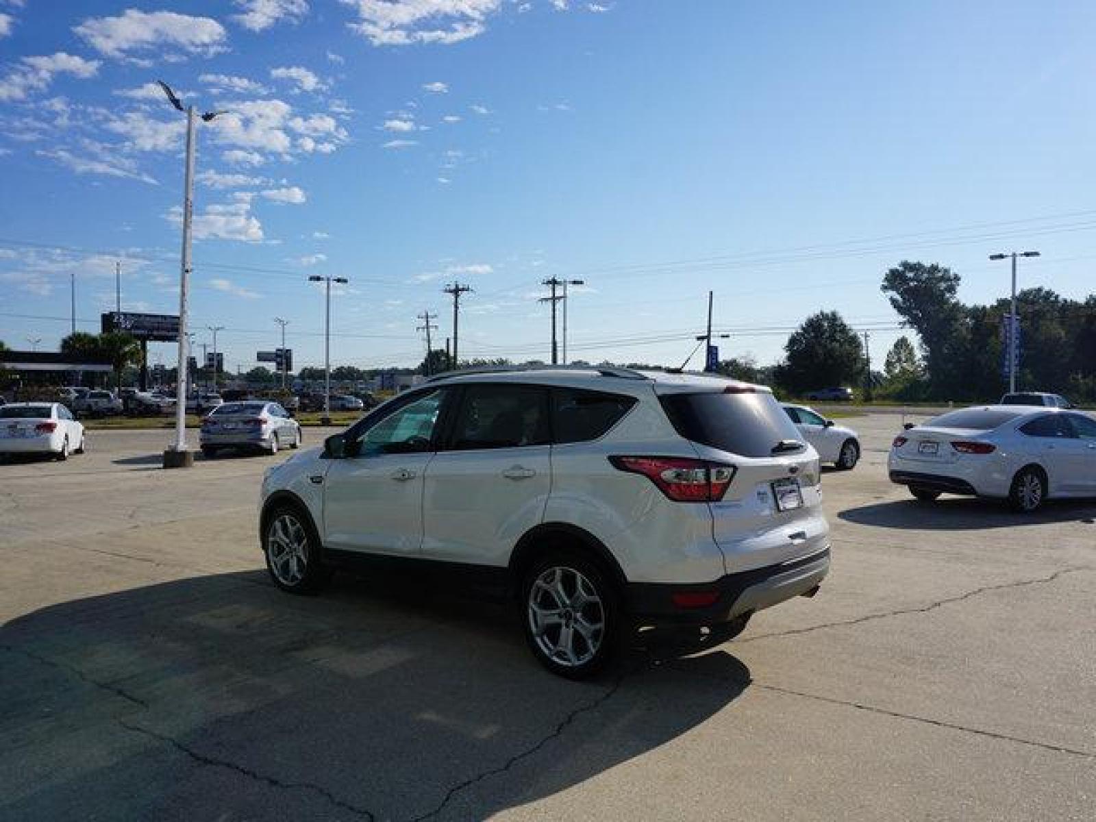 2017 White Ford Escape (1FMCU0J95HU) with an 2.0L 4Cyl Ecoboost engine, Automatic transmission, located at 6904 Johnston St., Lafayette, LA, 70503, (337) 988-1960, 30.143589, -92.100601 - Prices are subject to change as improvements done by the service dept. Prices are for Cash sales only, Plus TTL. This Vehicle is Serviced well and Warranties Available too. Easy Financing. Drives Great and everything works. Price subject to change as improvements done by the service dept. Easy CR - Photo #5