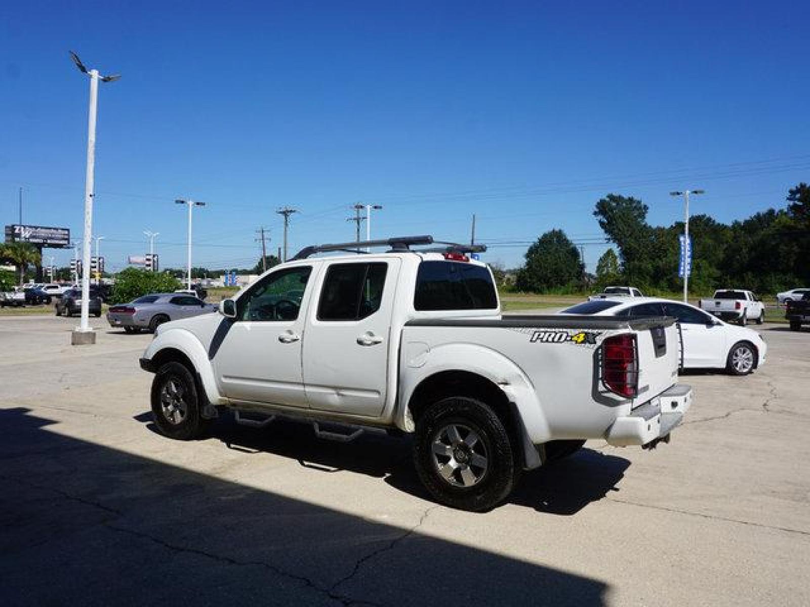 2013 White Nissan Frontier (1N6AD0EV5DN) with an 4.0L V6 engine, Automatic transmission, located at 6904 Johnston St., Lafayette, LA, 70503, (337) 988-1960, 30.143589, -92.100601 - Prices are subject to change as improvements done by the service dept. Prices are for Cash sales only, Plus TTL. This Vehicle is Serviced well and Warranties Available too. Easy Financing. Drives Great and everything works. Price subject to change as improvements done by the service dept. Easy CR - Photo #5