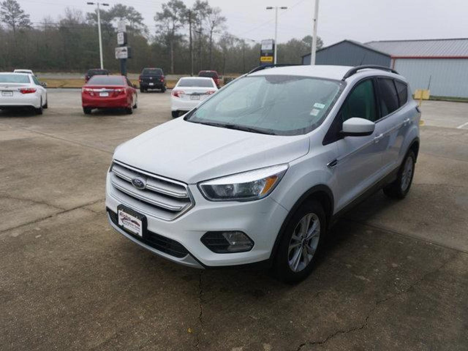 2018 White Ford Escape (1FMCU0GD4JU) with an 1.5L I4 EcoBoost engine, Automatic transmission, located at 6904 Johnston St., Lafayette, LA, 70503, (337) 988-1960, 30.143589, -92.100601 - Prices are subject to change as improvements done by the service dept. Prices are for Cash sales only, Plus TTL. This Vehicle is Serviced well and Warranties Available too. Easy Financing. Drives Great and everything works. Price subject to change as improvements done by the service dept. Easy CR - Photo #4