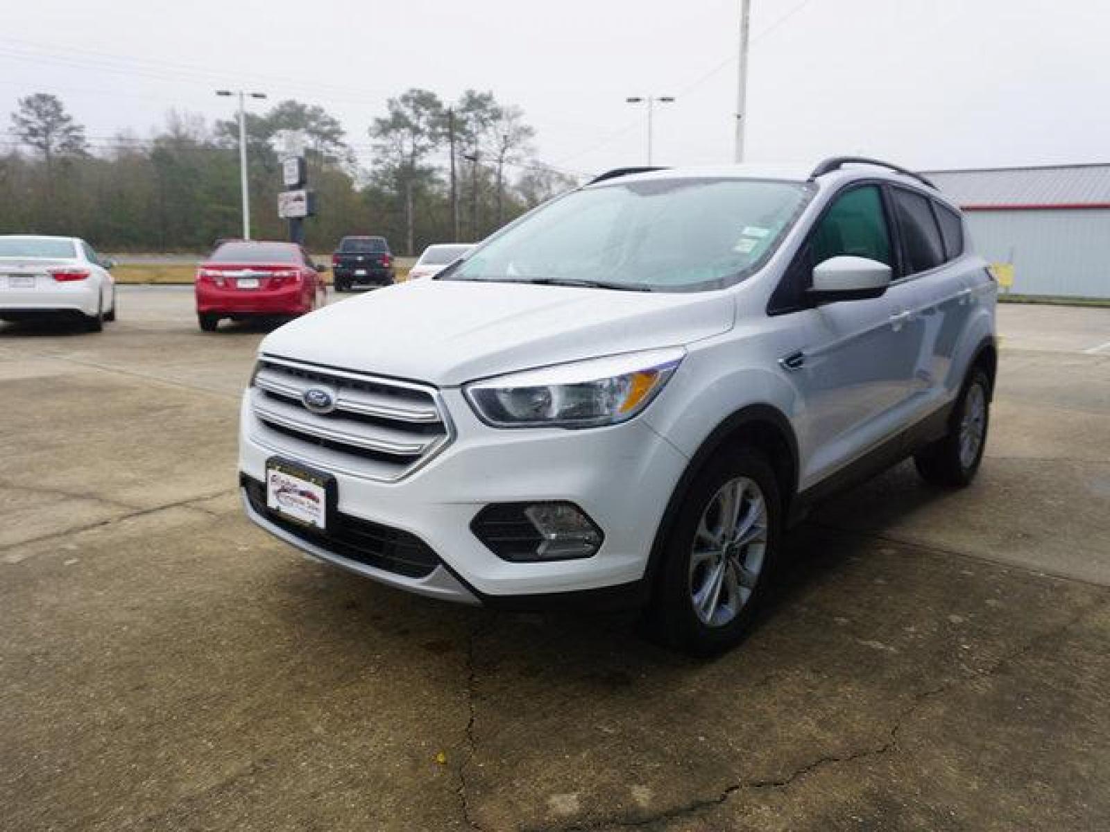 2018 White Ford Escape (1FMCU0GD4JU) with an 1.5L I4 EcoBoost engine, Automatic transmission, located at 6904 Johnston St., Lafayette, LA, 70503, (337) 988-1960, 30.143589, -92.100601 - Prices are subject to change as improvements done by the service dept. Prices are for Cash sales only, Plus TTL. This Vehicle is Serviced well and Warranties Available too. Easy Financing. Drives Great and everything works. Price subject to change as improvements done by the service dept. Easy CR - Photo #5