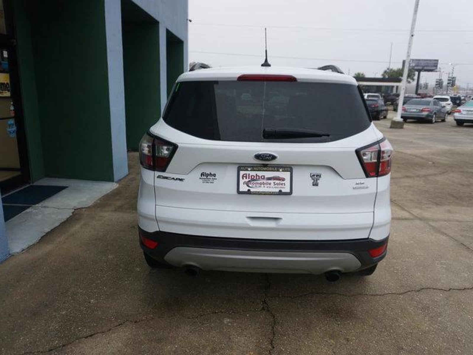 2018 White Ford Escape (1FMCU0GD4JU) with an 1.5L I4 EcoBoost engine, Automatic transmission, located at 6904 Johnston St., Lafayette, LA, 70503, (337) 988-1960, 30.143589, -92.100601 - Prices are subject to change as improvements done by the service dept. Prices are for Cash sales only, Plus TTL. This Vehicle is Serviced well and Warranties Available too. Easy Financing. Drives Great and everything works. Price subject to change as improvements done by the service dept. Easy CR - Photo #8