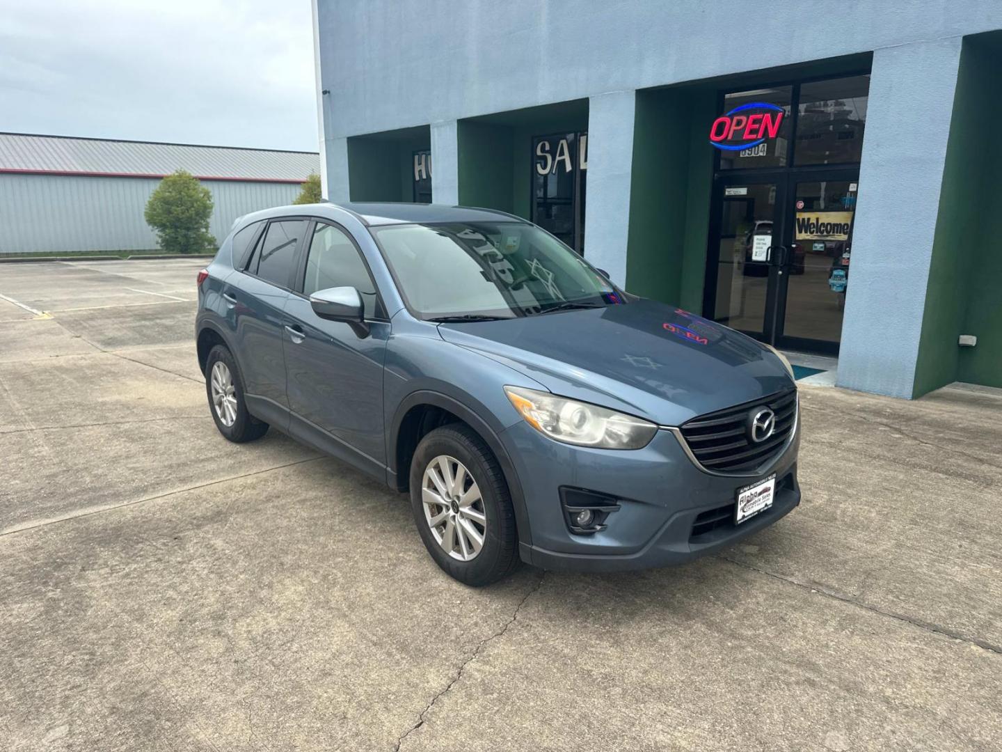 2016 Blue Reflex Mica /Black Mazda CX-5 FWD 4dr Auto Touring (JM3KE2CYXG0) , Automatic transmission, located at 6904 Johnston St., Lafayette, LA, 70503, (337) 988-1960, 30.143589, -92.100601 - Photo#1