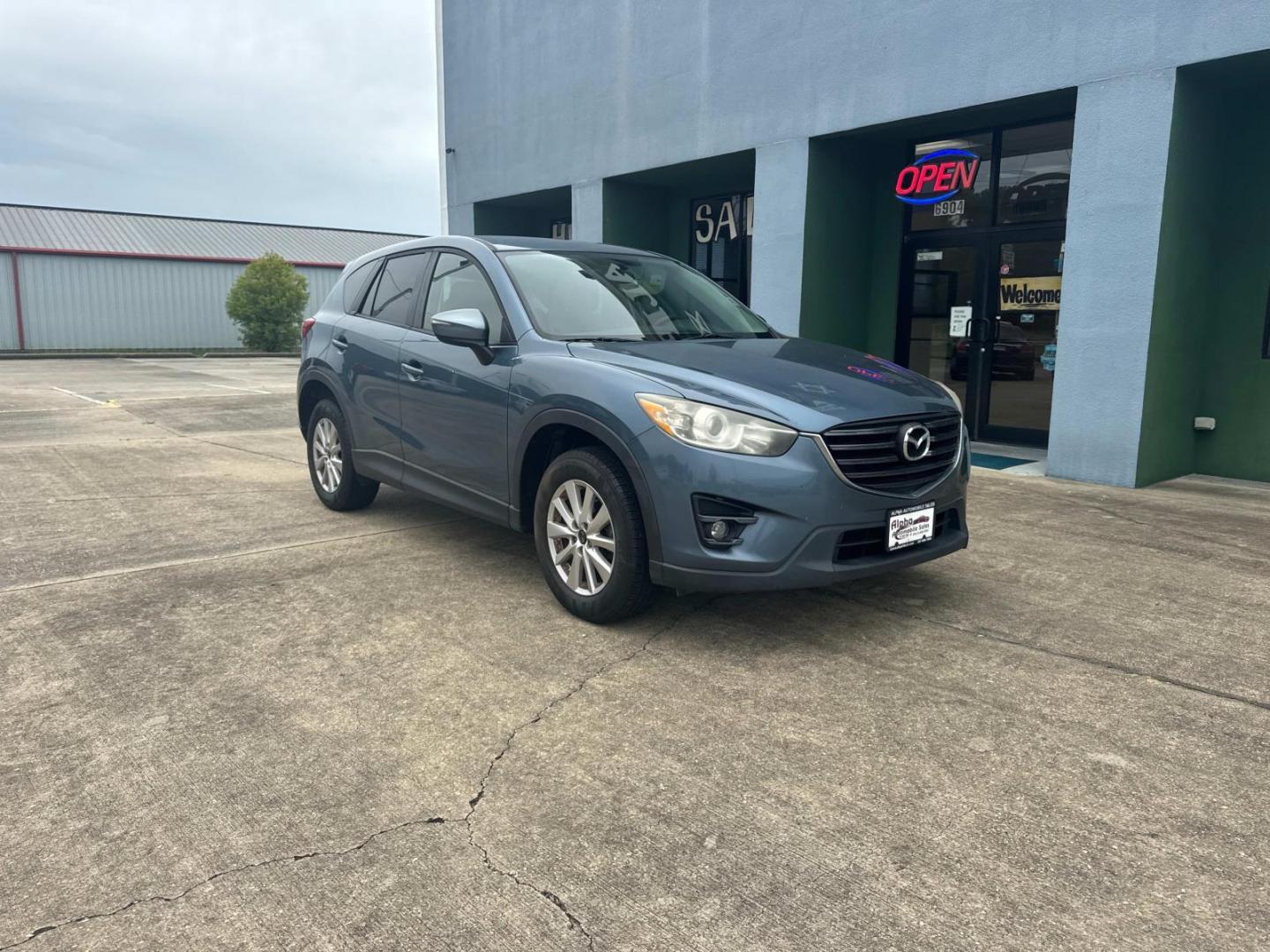 2016 Blue Reflex Mica /Black Mazda CX-5 FWD 4dr Auto Touring (JM3KE2CYXG0) , Automatic transmission, located at 6904 Johnston St., Lafayette, LA, 70503, (337) 988-1960, 30.143589, -92.100601 - Photo#2