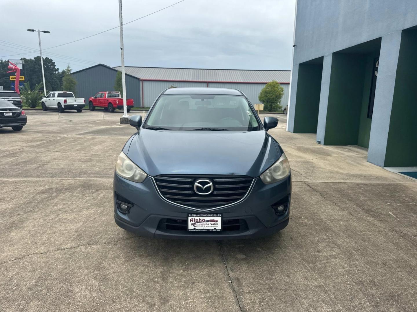 2016 Blue Reflex Mica /Black Mazda CX-5 FWD 4dr Auto Touring (JM3KE2CYXG0) , Automatic transmission, located at 6904 Johnston St., Lafayette, LA, 70503, (337) 988-1960, 30.143589, -92.100601 - Photo#3
