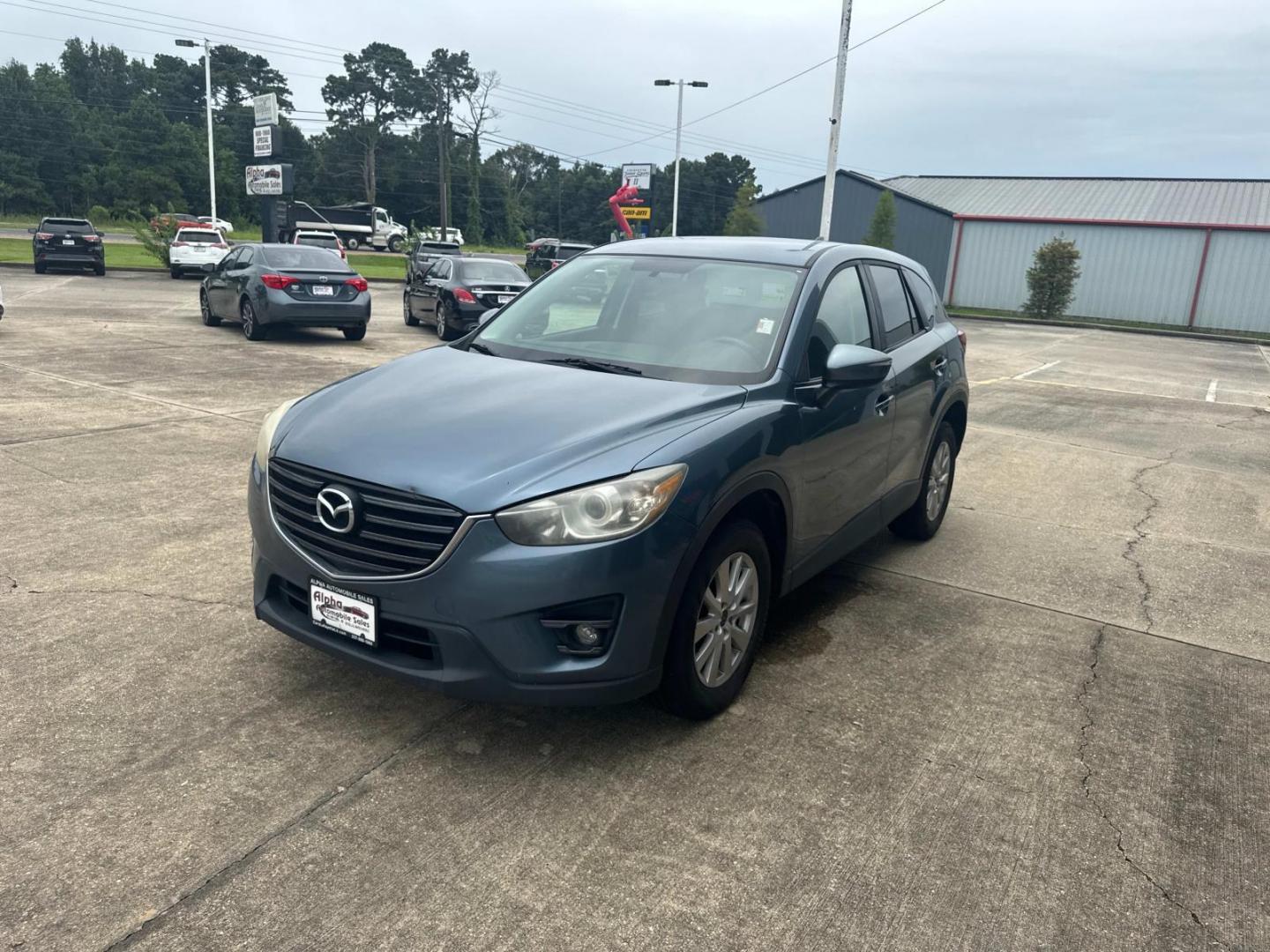 2016 Blue Reflex Mica /Black Mazda CX-5 FWD 4dr Auto Touring (JM3KE2CYXG0) , Automatic transmission, located at 6904 Johnston St., Lafayette, LA, 70503, (337) 988-1960, 30.143589, -92.100601 - Photo#5