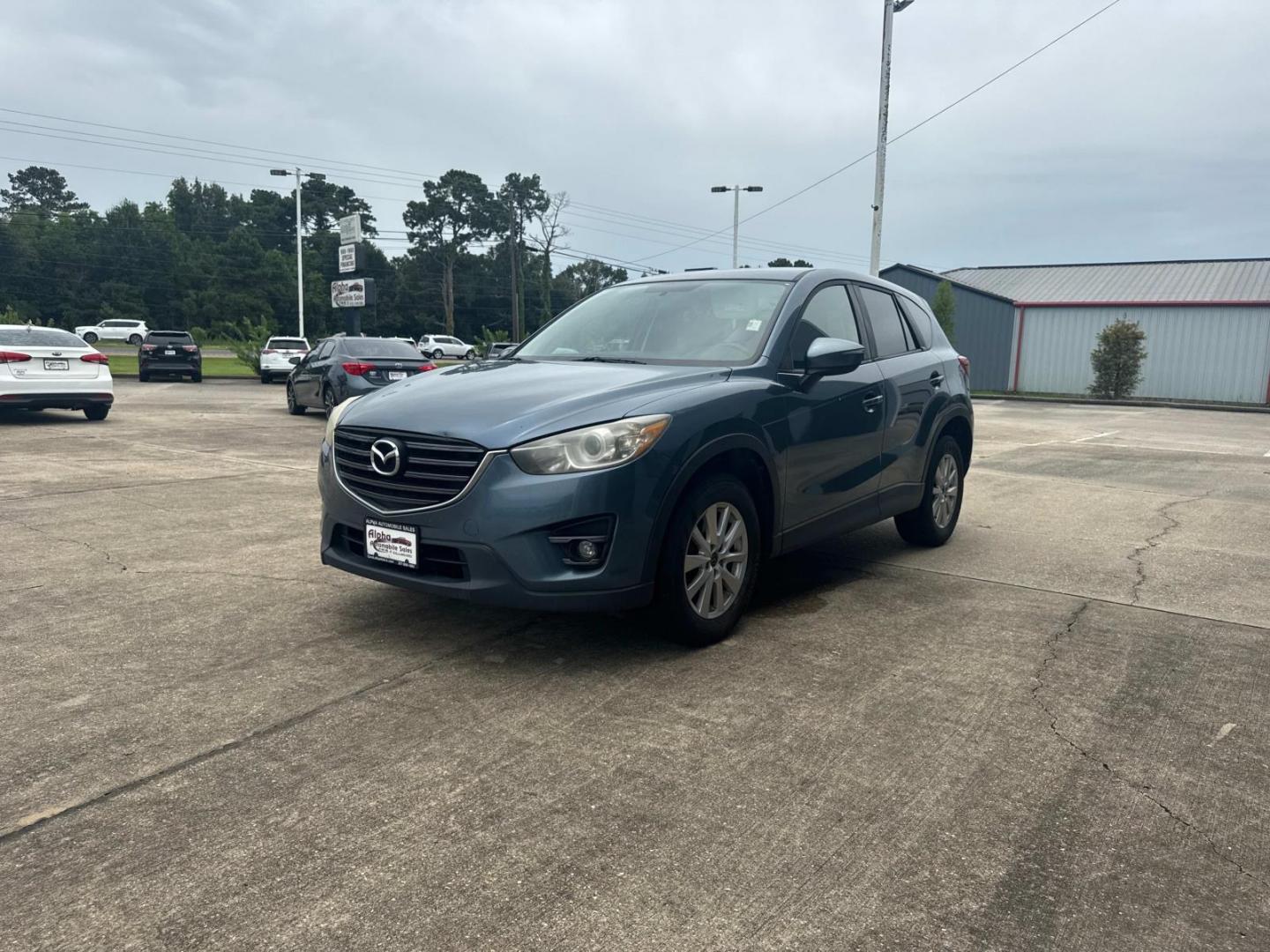 2016 Blue Reflex Mica /Black Mazda CX-5 FWD 4dr Auto Touring (JM3KE2CYXG0) , Automatic transmission, located at 6904 Johnston St., Lafayette, LA, 70503, (337) 988-1960, 30.143589, -92.100601 - Photo#6