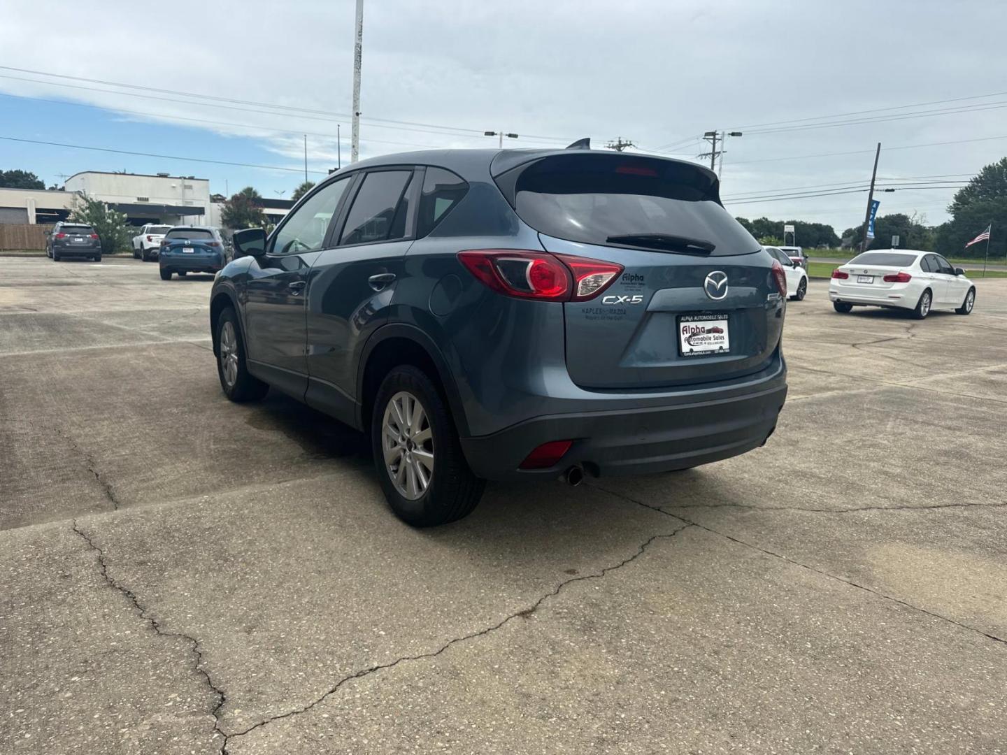 2016 Blue Reflex Mica /Black Mazda CX-5 FWD 4dr Auto Touring (JM3KE2CYXG0) , Automatic transmission, located at 6904 Johnston St., Lafayette, LA, 70503, (337) 988-1960, 30.143589, -92.100601 - Photo#9
