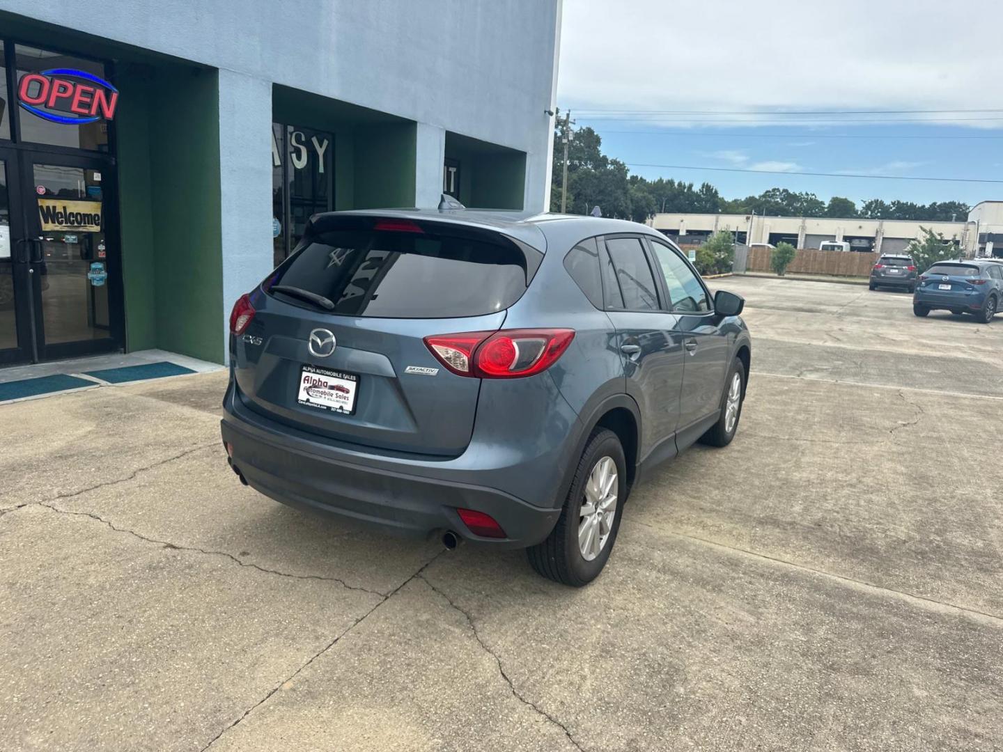 2016 Blue Reflex Mica /Black Mazda CX-5 FWD 4dr Auto Touring (JM3KE2CYXG0) , Automatic transmission, located at 6904 Johnston St., Lafayette, LA, 70503, (337) 988-1960, 30.143589, -92.100601 - Photo#12