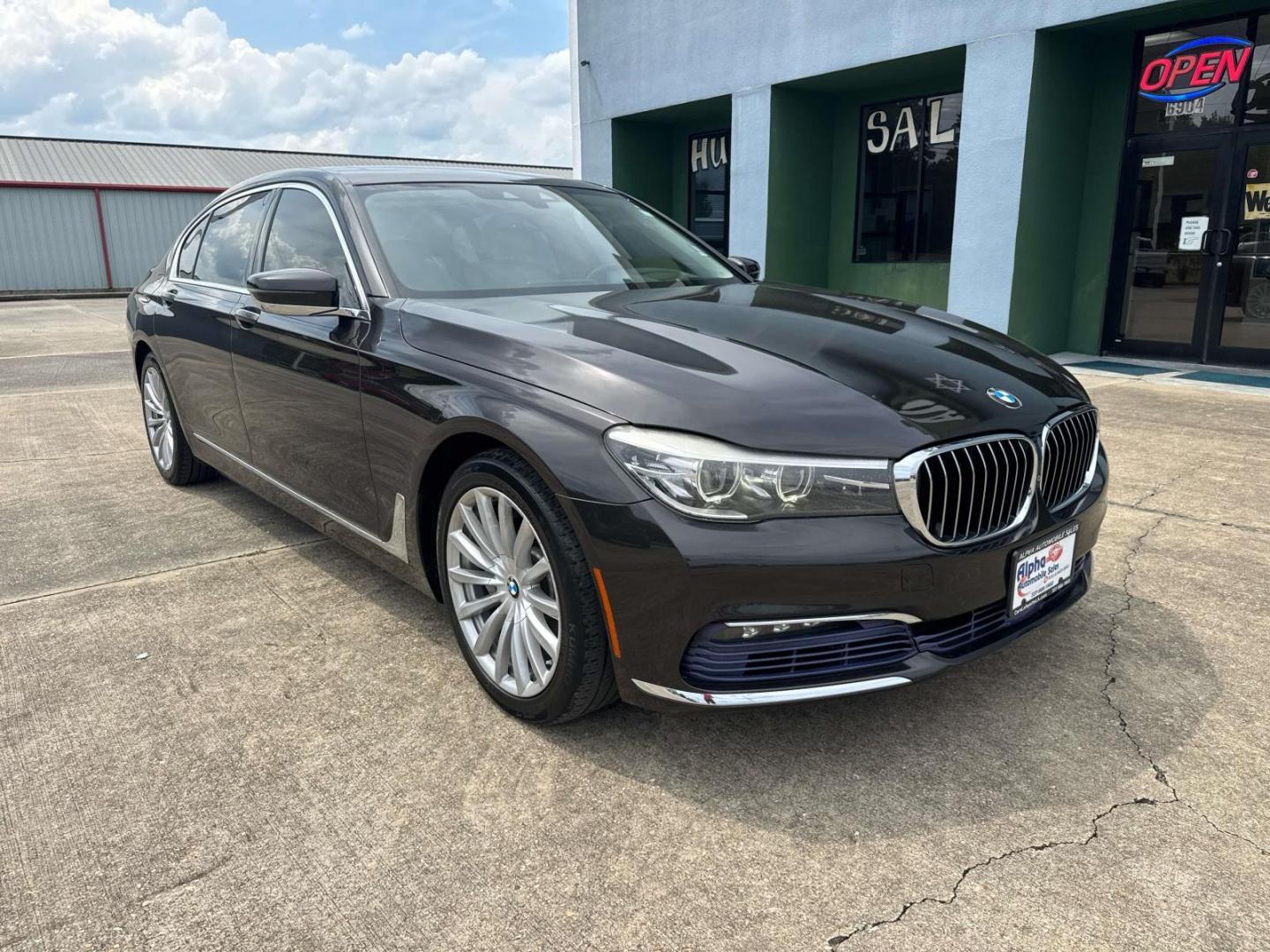 2016 Black /Canberra Beige BMW 7 Series 4dr Sdn 740i RWD (WBA7E2C53GG) , Automatic transmission, located at 6904 Johnston St., Lafayette, LA, 70503, (337) 988-1960, 30.143589, -92.100601 - Photo#2