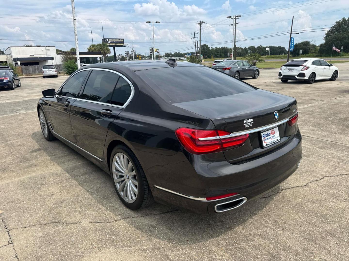 2016 Black /Canberra Beige BMW 7 Series 4dr Sdn 740i RWD (WBA7E2C53GG) , Automatic transmission, located at 6904 Johnston St., Lafayette, LA, 70503, (337) 988-1960, 30.143589, -92.100601 - Photo#8