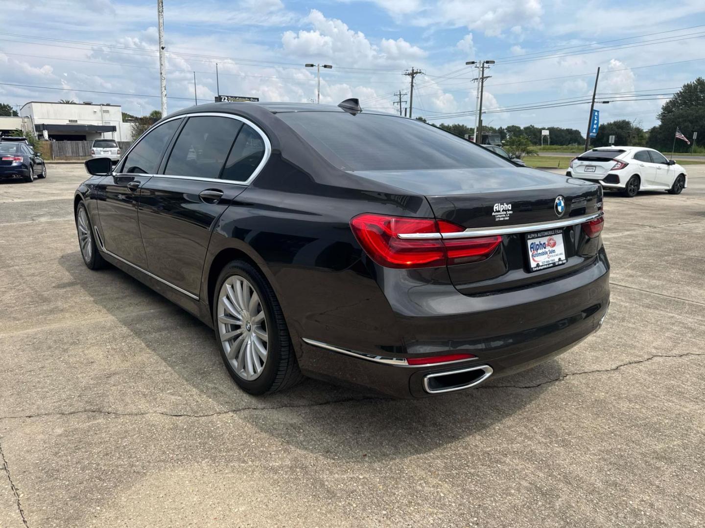 2016 Black /Canberra Beige BMW 7 Series 4dr Sdn 740i RWD (WBA7E2C53GG) , Automatic transmission, located at 6904 Johnston St., Lafayette, LA, 70503, (337) 988-1960, 30.143589, -92.100601 - Photo#9