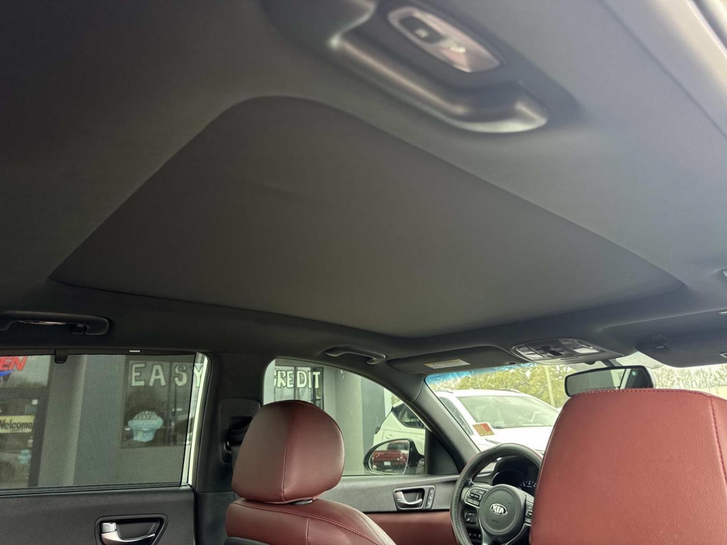 2016 White /Maroon Kia Optima 4dr Sdn SX Turbo (5XXGW4L2XGG) , Automatic transmission, located at 6904 Johnston St., Lafayette, LA, 70503, (337) 988-1960, 30.143589, -92.100601 - Photo#9