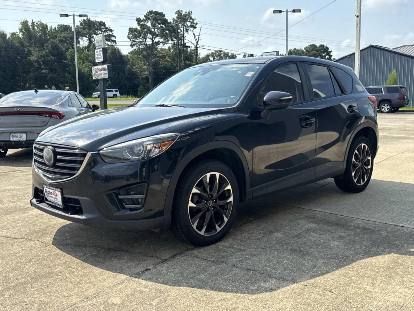 2016 Black /Black Mazda CX-5 FWD 4dr Auto Grand Touring (JM3KE2DY7G0) , Automatic transmission, located at 6904 Johnston St., Lafayette, LA, 70503, (337) 988-1960, 30.143589, -92.100601- Photo#3